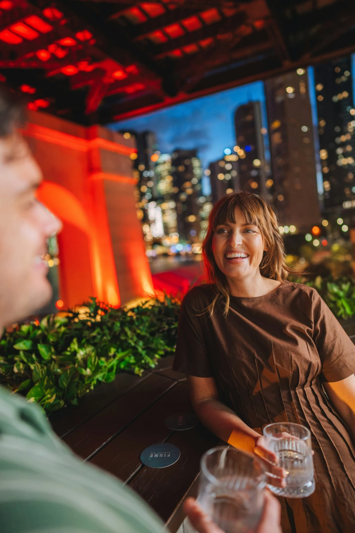 Friends catching up over drinks at night