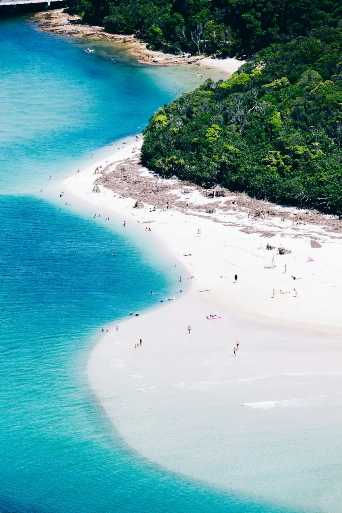 Aerial of a white sand beach and turquoise water