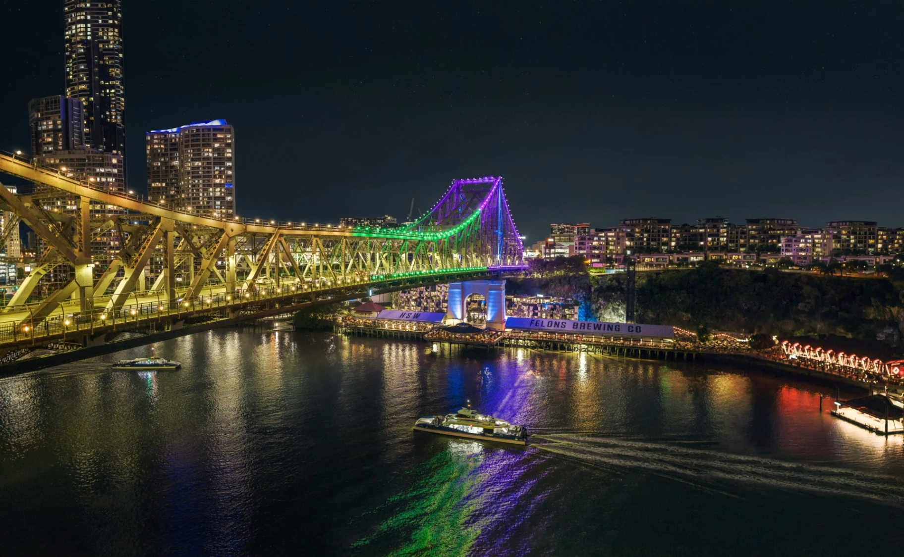 Story Bridge lit up at night above the Brisbane River